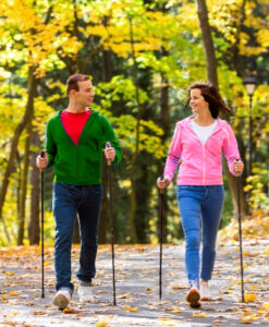 Man and woman doing Nordic walking