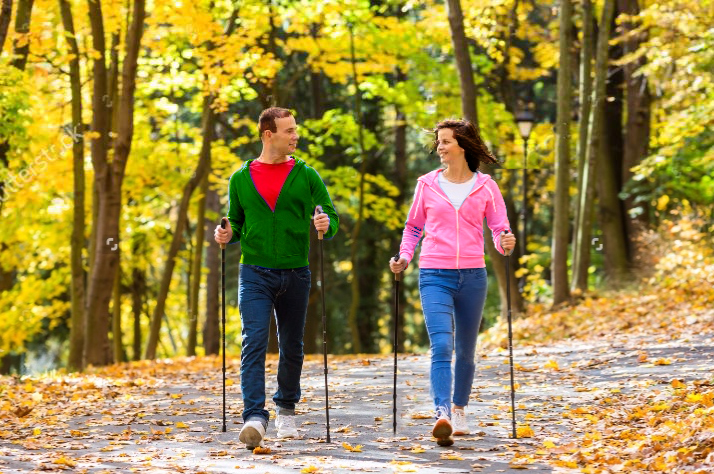 Man and woman doing Nordic walking