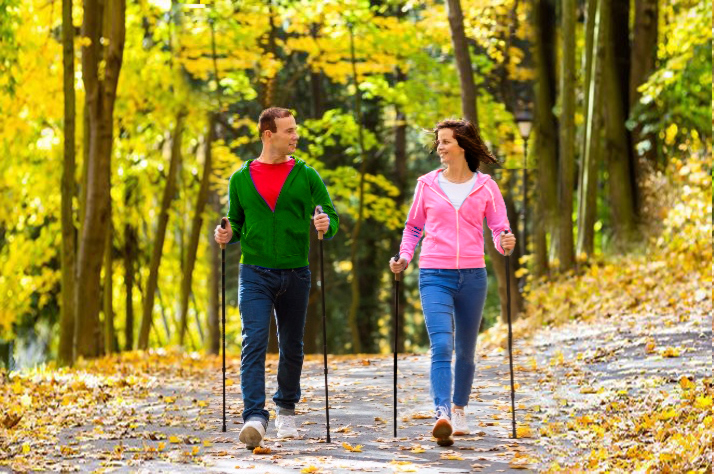 Man and woman Nordic walking